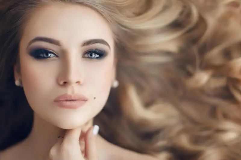 Woman with radiant skin and glamorous makeup